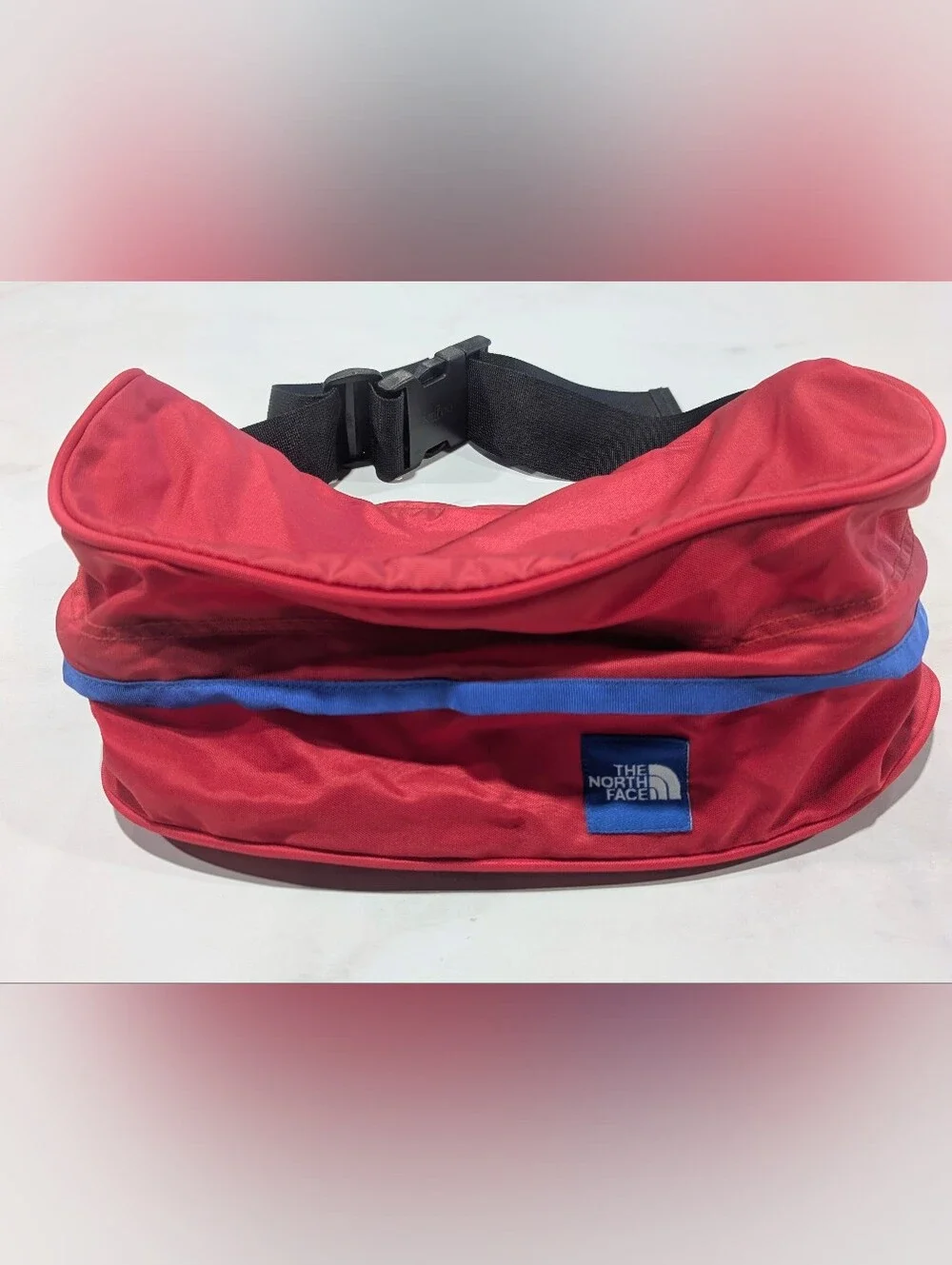 The North Face Red Lumbar Pack with Blue Trim